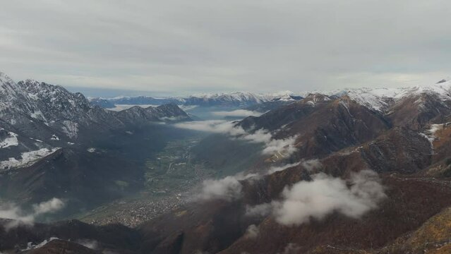 Drone footage at ski resort, Barzio, Lecco, Italy above the clouds looking across to the mountain Grigna Settentrionale