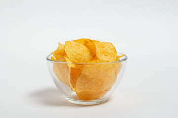 Crispy and salty chips on a white background