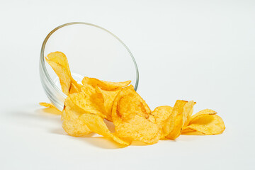 Crispy and salty chips on a white background