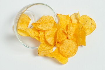 Crispy and salty chips on a white background