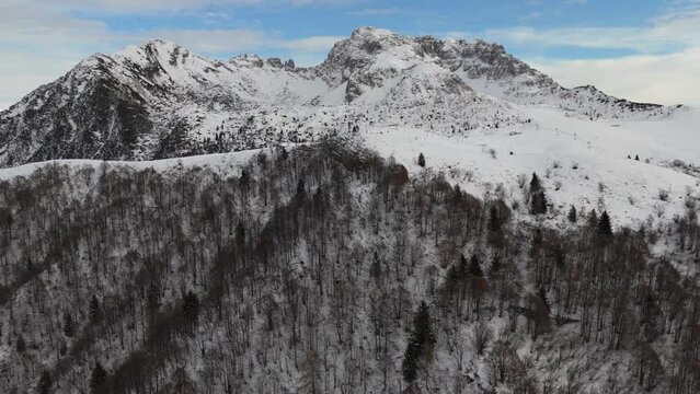 Drone footage at Piani Di Bobbio, Barzio, Lecco, Italy above the clouds looking across to the mountain Grigna Settentrionale