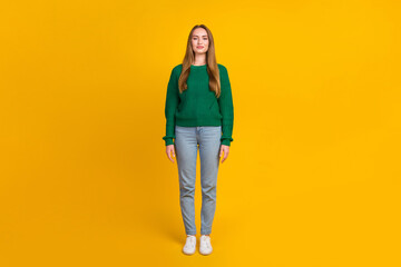 Full body size photo of blonde girl wearing green pullover standing not moving in trendy casual...