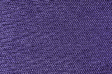 Textile background, purple coarse fabric texture, jacquard woven upholstery, furniture textile material, wallpaper, backdrop. Cloth structure close up.