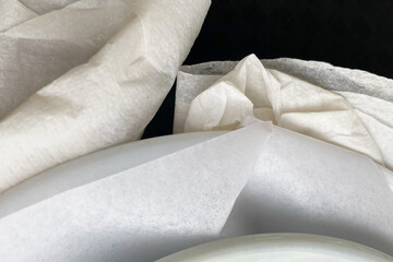 Close-up of a white napkin in a dishwasher machine