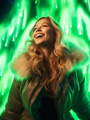 A woman smiling with green lights behind her