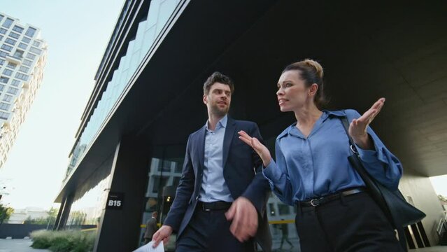 Upset business partners leaving office dissatisfied work failure throwing papers