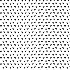 Hand-drawn doodle seamless pattern with hearts. Black and white. Cute Hand-drawn nursery cartoon doodle. Black shapes on a white background. Perfect for printing fabrics, packaging, clothes 