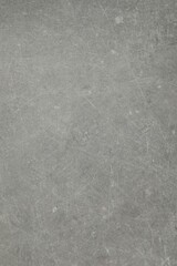 Texture of light grey stone surface as background, closeup