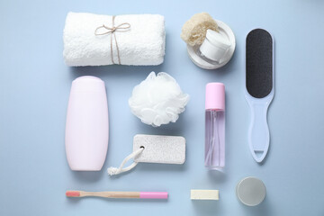 Bath accessories. Flat lay composition with personal care products on light blue background