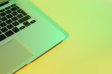 Modern laptop on green background