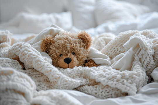 teddy bear in bed