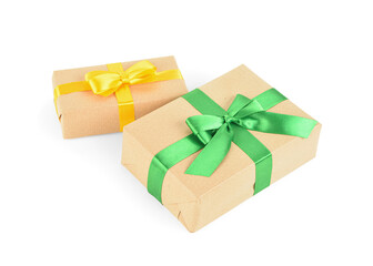 Christmas gift boxes with yellow and green ribbons on white background