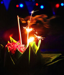 fireworks in the night as a part of  an annual floating basket festival in full moon night in Thailand