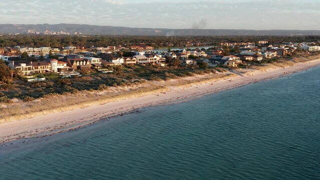 Wide aerial of Tennyson Beach suburb with Adelaide city in background, South Australia