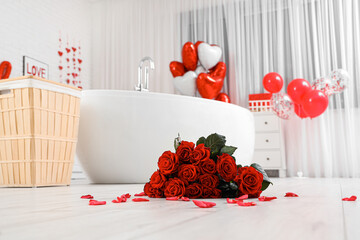 Interior of festive bathroom with bouquet of roses and heart-shaped balloons. Valentine's Day...