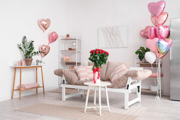 Interior of festive living room decorated with heart-shaped balloons for Valentine's Day celebration