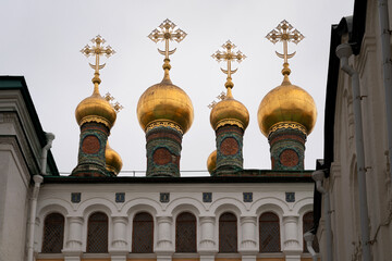Fototapeta na wymiar Domes of the Verkhospassky Cathedral on the Cathedral Square of the Moscow Kremlin on an autumn day, Moscow, Russia