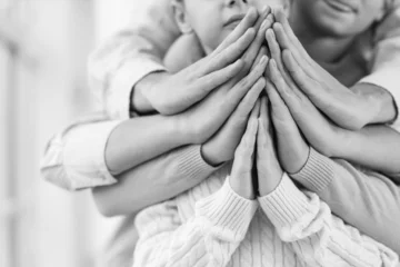 Fotobehang Family praying together at home, closeup © Pixel-Shot