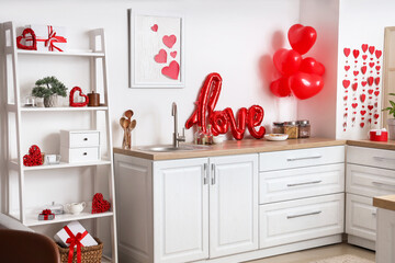 Interior of light kitchen with heart-shaped balloons and decorations for Valentine's Day celebration