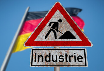 Flagge von Deutschland und Schild Baustelle Industrie