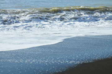 Blue ocean waves on the beach. Natural seascape photograph. 