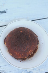 Round shape torn bread with abon topping in a plate on the table