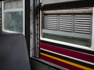 A view from the window of the old train at a train station in Thailand