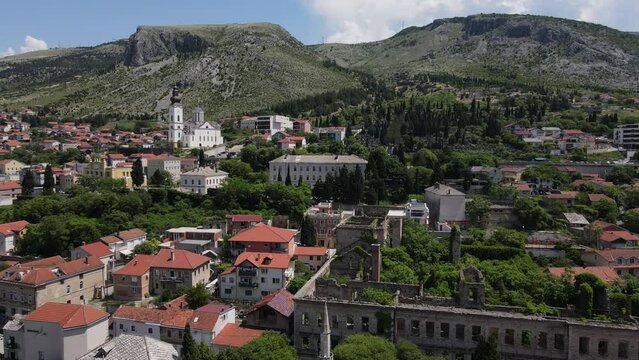 The image of the city's stone houses and the harmony of the historical Mostar bridge with the urban texture