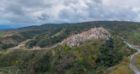 drone perspective of the picturesque mountain village and church of Badolato in Calabria