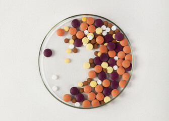 Petri dish with pills.