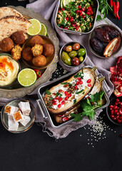 Middle eastern or Arabic different dishes on black background. Tasty traditional food concept