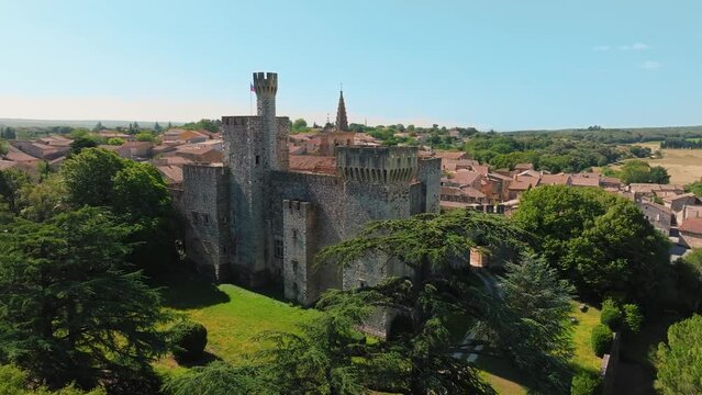 Slow orbiting shot of the antique Chateau de Pouzilhac in the south of France