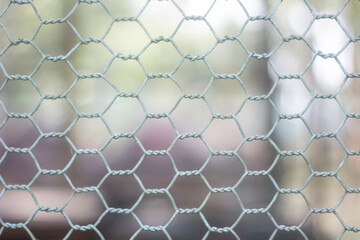 round wire fence and blurred background