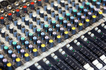 mixing console in music recording studio