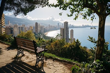 A bench overlooking a city and beach