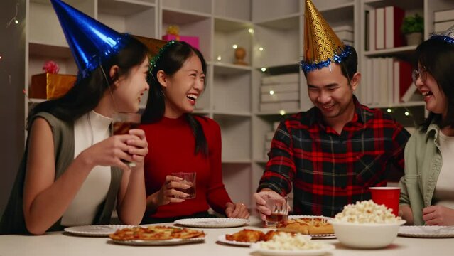 Friends join and celebrate the party with eating foods and drinks. Happy and joyful in holiday weekend and festival.