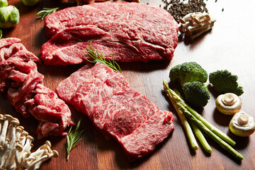 Raw meat on plate with various spices and vegetables	