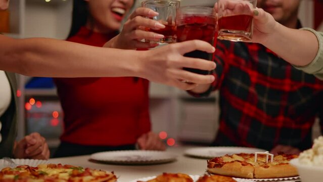 Friends join and celebrate the party with get cheers give a toast by clink glasses eating foods and drinks. Happy and joyful in holiday weekend and festival.