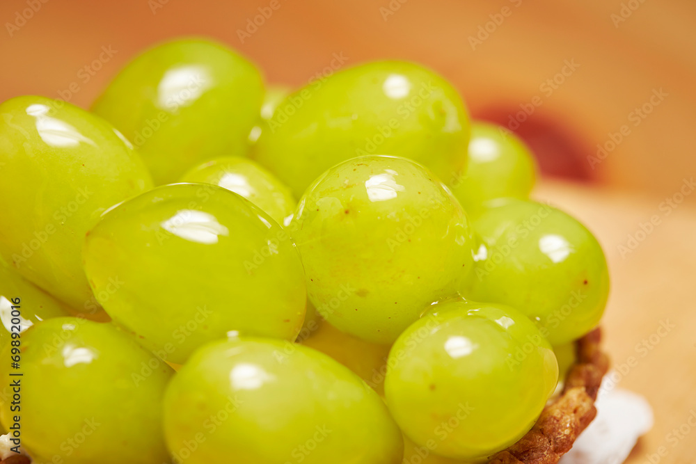 Sticker green grape tart on a plate