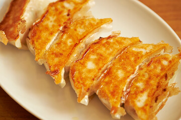  fried dumplings on a plate