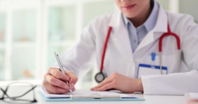 Doctor filling out medical documentation in clinic 4k movie slow motion