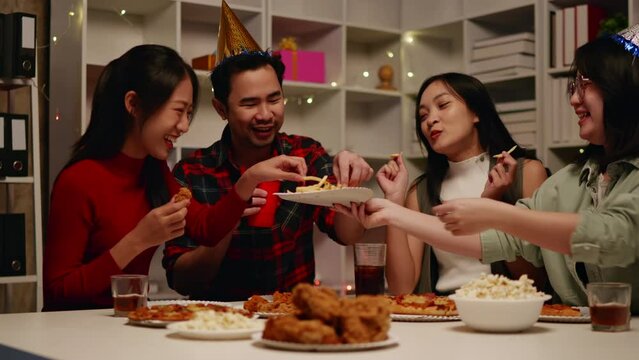 Friends join and celebrate the party with eating foods and drinks. Happy and joyful in holiday weekend and festival.