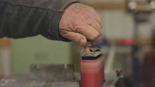person adjusting sander