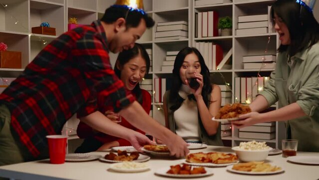 Friends join and celebrate the party with get cheers give a toast by clink glasses eating foods and drinks. Happy and joyful in holiday weekend and festival.