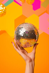 Disco ball in the hand. Party time concept.