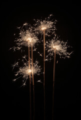 Fototapeta premium Sparkler on black background. New years concept.