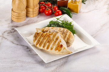 Grilled chicken breast served arugula