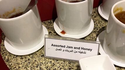 Assorted jam and honey in breakfast buffet, restaurant in Cairo, Egypt.