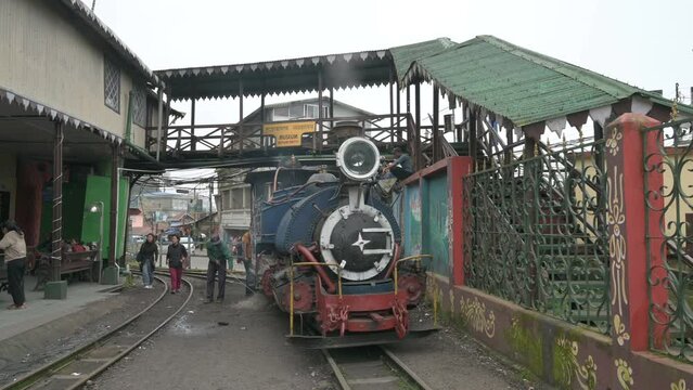 Darjeeling,West Bengal,India-20.08.2023 : Steam engine Toy train being prepared for journey through Himalayas, at Ghum station. Historical famous Unesco world heritage of Darjeeling Himalayan Railway.