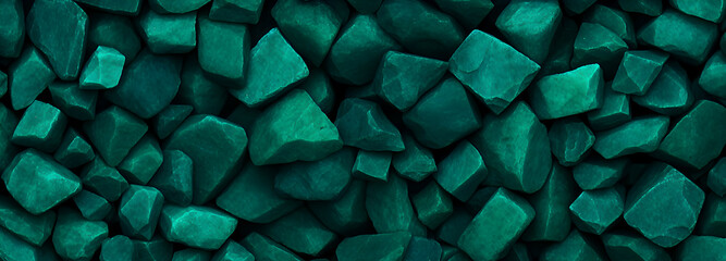 many jagged, rough-cut stones in various shades of deep teal and green, closely packed together to form a textured surface